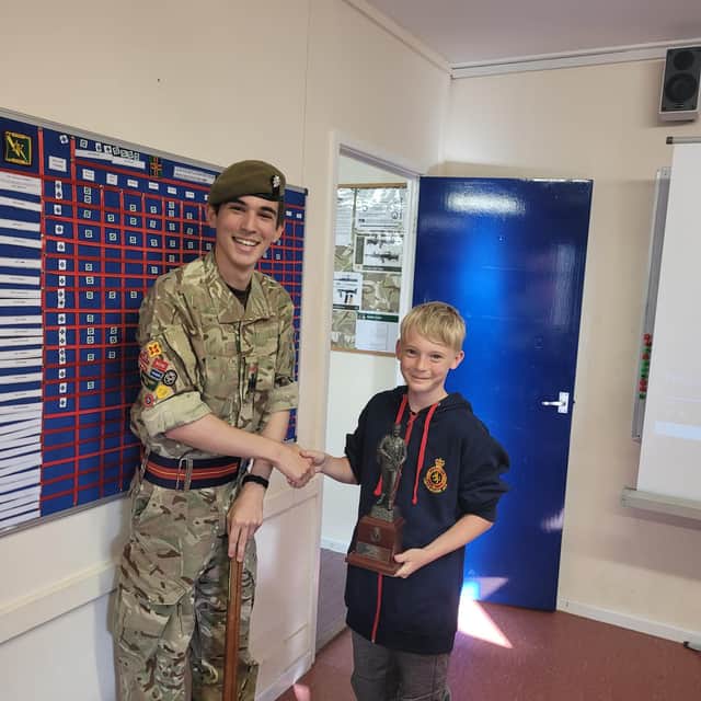 Louth Detachment's newest cadet recruit Etienne Brown had the honour of presenting Cadet Regimental Sergeant Major Alfie Nelson with his leaving gift.