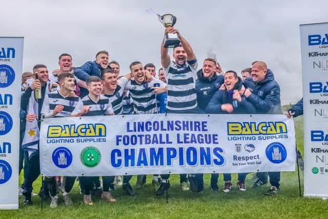 Louth Town's players celebrate the league and cup double.