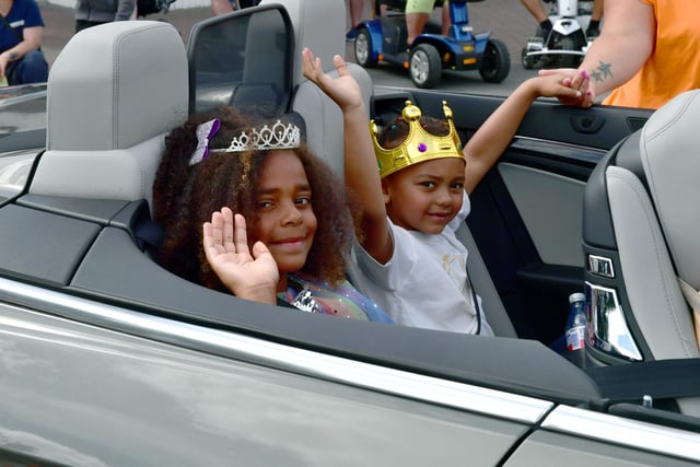 Chapel St Leonards Prince and Princess Aaron Rose, 6, and Ella Duncan-Cramp, 10,  travelled in an open top sports car.