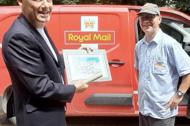 Kirkby on Bain Parish Council chairman, Martin Briscombe, presents Ian with his gifts.