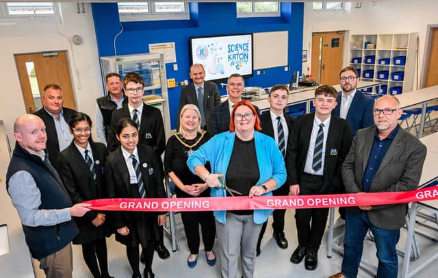 Principal Mrs Ricketts cuts the ribbon to formally unveil the academy’s refurbishment. She is joined in one of the refurbished science laboratories by students (left to right) Bilha Alias, Diya George, Christopher Bilverstone, Kaden Armstrong and Lucas Delacour; the Mayor Cllr Hazel Fox; LGAT’s Chief Executive Officer Martin Brown (back, centre) and Assistant Director of Education at North Lincolnshire Council Paul Tinsley (fifth right). Also pictured (left to right) are Andy Staunton from Richard Eves Architects; Steve Henderson, Synergi Energy Systems; Andrew Mathieson, Cube3; Luke Scorer from electrical consultants Aptus Ltd; and Sean Hunter, Cube 3.