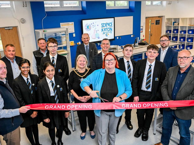 Principal Mrs Ricketts cuts the ribbon to formally unveil the academy’s refurbishment. She is joined in one of the refurbished science laboratories by students (left to right) Bilha Alias, Diya George, Christopher Bilverstone, Kaden Armstrong and Lucas Delacour; the Mayor Cllr Hazel Fox; LGAT’s Chief Executive Officer Martin Brown (back, centre) and Assistant Director of Education at North Lincolnshire Council Paul Tinsley (fifth right). Also pictured (left to right) are Andy Staunton from Richard Eves Architects; Steve Henderson, Synergi Energy Systems; Andrew Mathieson, Cube3; Luke Scorer from electrical consultants Aptus Ltd; and Sean Hunter, Cube 3.