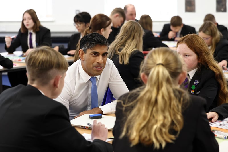 Rishi Sunak talks with pupils during a visit to Giles Academy in Old Leake. (Photo by Darren Staples - WPA Pool/Getty Images)