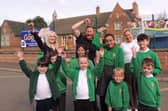 Executive headteacher Sophie Foston, chairman of governors Matt Timings and assistant headteacher Sarah Gray celebrate with pupils after their latest 'Good' Ofsted rating.
