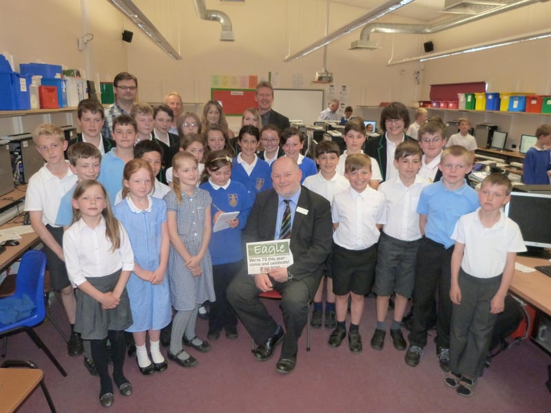 A scene from a journalism day at Caistor Yarborough Academy. Participants worked together to create a 16-page newspaper, titled The Eagle. Pictured are pupils from Caistor Primary School and Caistor Yarborough Academy, journalist advisors from the University of Lincoln, and Caistor Yarborough Academy Jeremy Newnham (seated), who was interviewed by the children as part of the day.