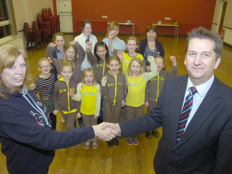 The 3rd Cranwell Brownies receiving £300 from solicitors Sills and Betteridge to help meet running costs. Pictured are Anne Riddington, Brown Owl, and Andrew Goldborough, of Sills and Betteridge.