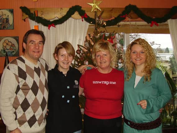 A Christmas family photo. From left, Nigel, daughter Yasmin, Kim and daughter Sophie.