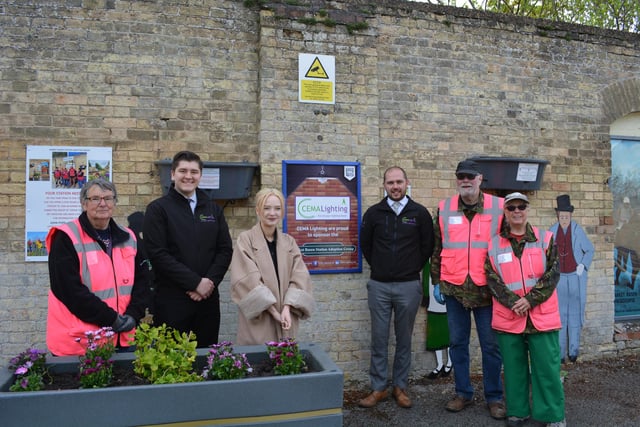 Market Rasen's Cema Lighting has become the latest supporter of the Market Rasen Adoption group. Cema's Matthew Foster, Shannon Friend and Ashley Varley are pictured with some of the station volunteers