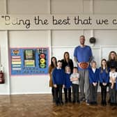 Paul Sturgess with Grimoldby Primary School staff and pupils.