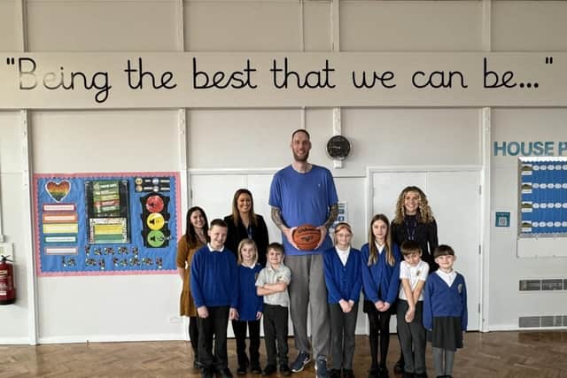 Paul Sturgess with Grimoldby Primary School staff and pupils.
