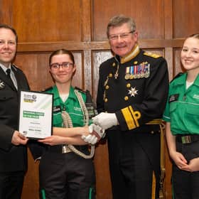 Martha Davies (centre) receives her title of Regional Cadet of the Year for the East Midlands. Photo: Brian Aldrich Photography