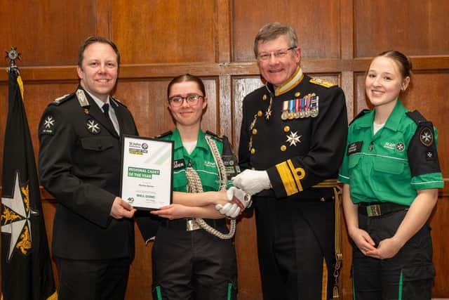 Martha Davies (centre) receives her title of Regional Cadet of the Year for the East Midlands. Photo: Brian Aldrich Photography