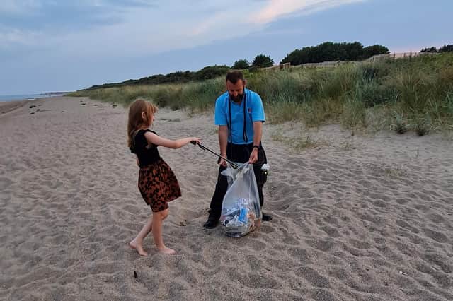 Sofia found the first bag on the beach and quickly filled it.