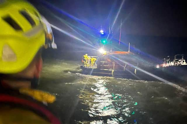 Still shot from the helmet camera on board Skegness RNLI during the transfer with Humber RNLI.