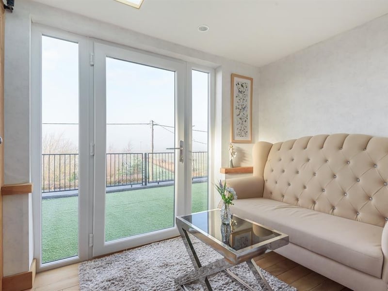 An area off the same bedroom that leads to the balcony.