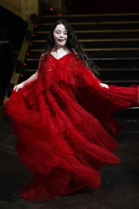 British Vogue cover girl Ellie Goldstein wearing a red Sanyukta Shrestha eco gown.