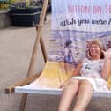 Lindy Taylor enjoying a giant deckchair at Sutton on Sea's vintage festival.