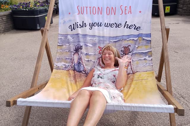Lindy Taylor enjoying a giant deckchair at Sutton on Sea's vintage festival.