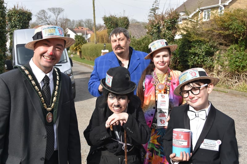 Dee'Dee Lee and her family with the Deputy Mayor of Skegness doing something funny for money for Comic Relief.