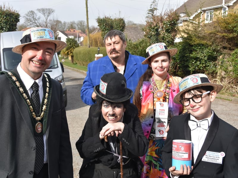 Dee'Dee Lee and her family with the Deputy Mayor of Skegness doing something funny for money for Comic Relief.