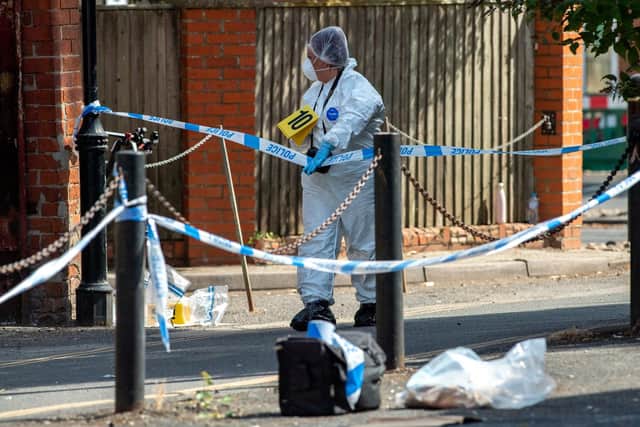 Forensics on the scene in Boston's Fountain Lane. Photos by John Aron