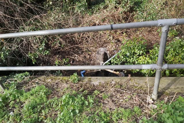 A dumped shopping trolley helps to choke the water block of the Beck. Photo supplied