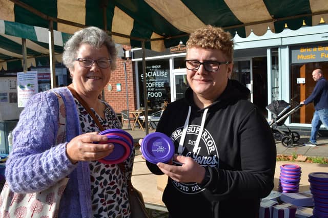 Town councillor Freddie Easters with Lis Eastburn at the Anglian Water stand