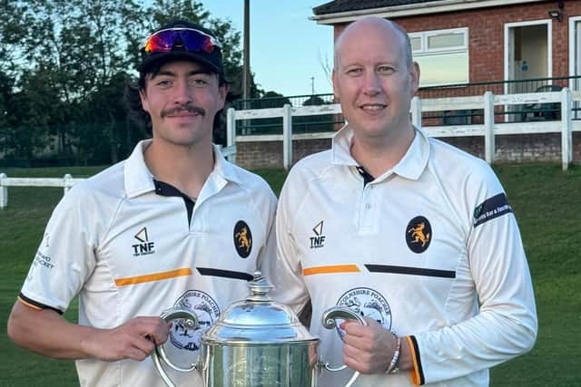 Barend Lourens and captain Jason Collinson with the league trophy.