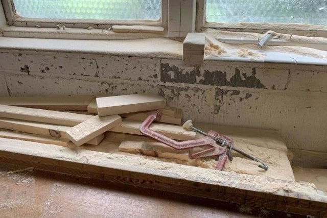 Wood dust coating a bench and windowsill at The Furniture Chest workshop. Photo: HSE