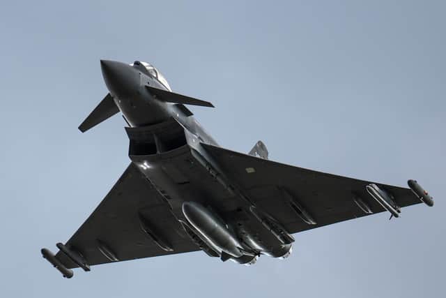 An RAF Typhoon fighter aircraft flies at RAF Coningsby, which is home to frontline Typhoon units and is also the training station for Typhoon pilots. (PHOTO BY: Christopher Furlong/Getty Images)