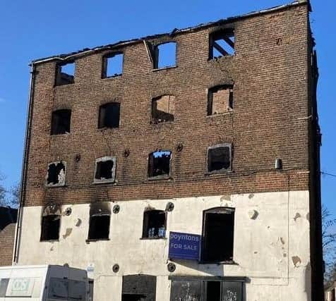 Boston Borough Council is warning people that the gutted warehouse building on London Road is in danger of collapsing.