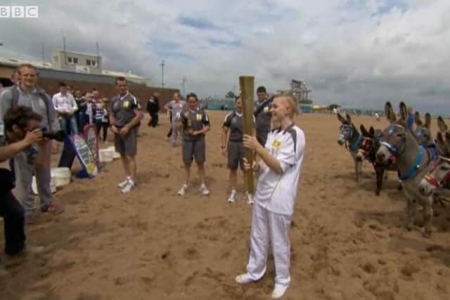 Starr Halley arrives on Skegness beach in the  2012 Queen's Baton Relay for the Olympic Games.
