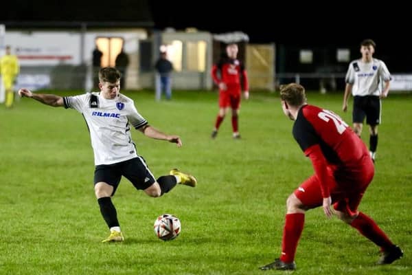 Louth's Bailey Wright in action against Beverley Town.