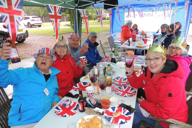 Families and neighbours enjoying a rainy street party on Grange Close in Ruskington.