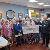 A cheque for £660 is preented to Steve Tandy, Lincs and Notts Air Ambulance volunteer, by the Heritage Bingo Group during a meeting at the Bell Inn.
