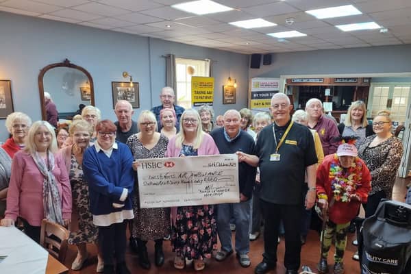 A cheque for £660 is preented to Steve Tandy, Lincs and Notts Air Ambulance volunteer, by the Heritage Bingo Group during a meeting at the Bell Inn.