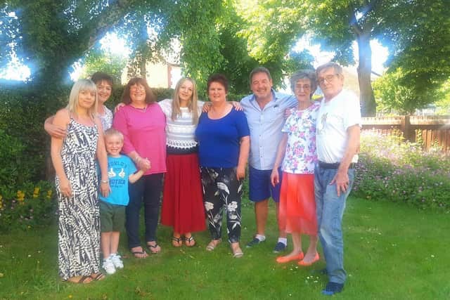 Marie Pattison pictured with her mum, dad and other members of the family