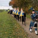 A procession makes its way towards the site of the memorial near Benington.