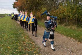 A procession makes its way towards the site of the memorial near Benington.