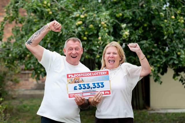 Teresa and Wayne, of Glentham, celebrate their Postcode Lottery win.