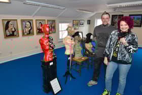 Gallery owners Dale Lodge with puppy, Ozzy, and Matt Lodge