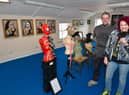 Gallery owners Dale Lodge with puppy, Ozzy, and Matt Lodge