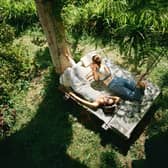 People in nature enjoying the morning sun, one of the key factors in getting a good night's sleep