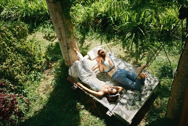 People in nature enjoying the morning sun, one of the key factors in getting a good night's sleep