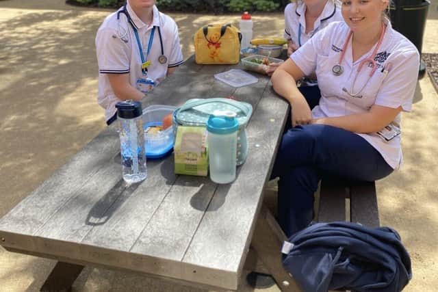 Staff enjoying their lunch in the new garden