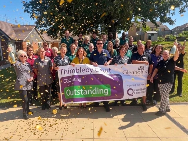 The team at Thimbleby Court celebrate their outstanding CQC rating.