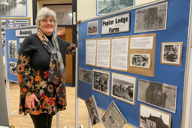 Volunteer Anne Poynton with a display about Popular Lodge Farm where she was born