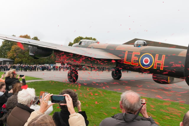 50,000 poppies were released by the Lancaster NX611 "Just Jane" flaps at the end of her taxi run to mark the launch of this year's Poppy Appeal.