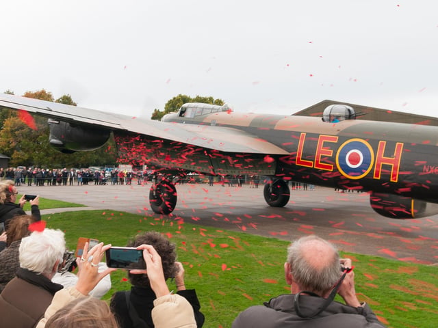 50,000 poppies were released by the Lancaster NX611 "Just Jane" flaps at the end of her taxi run to mark the launch of this year's Poppy Appeal.