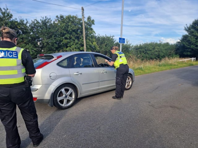 A spot check is made on vehicle during a police operation.